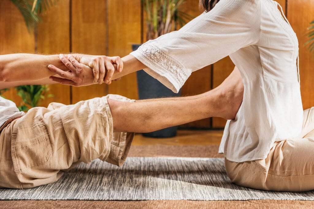 Pushing feet into back massage | Traditional Thai Massage Tampa | Breathe In Massage | About Breathe In Massage | Denis Puebla Licensed Massage Therapist